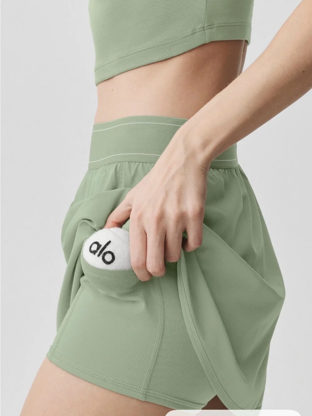 ALO Yoga match point tennis skirt in dune grass color
